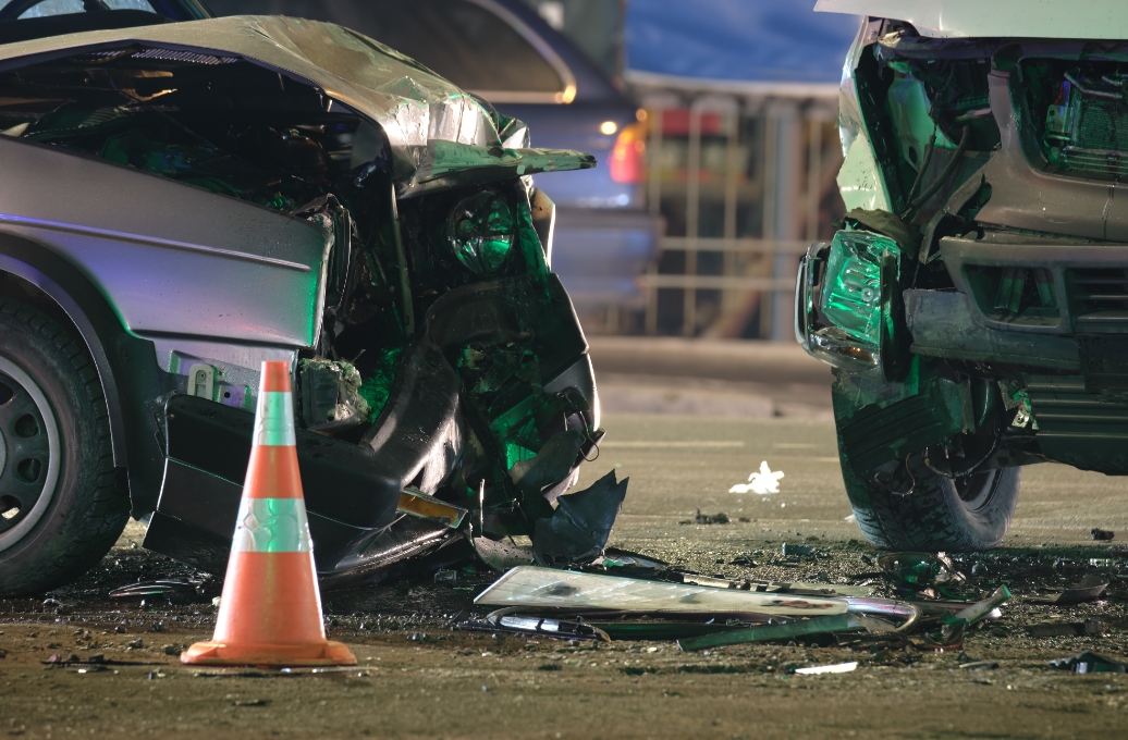 Two cars collide on a city street, resulting in a car accident legal case.