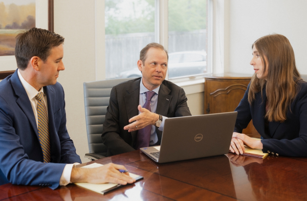 Roman & Boock attorneys discussing their personal injury claims process.