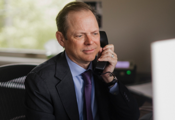 Attorney Jamie Boock listening to a phone call.