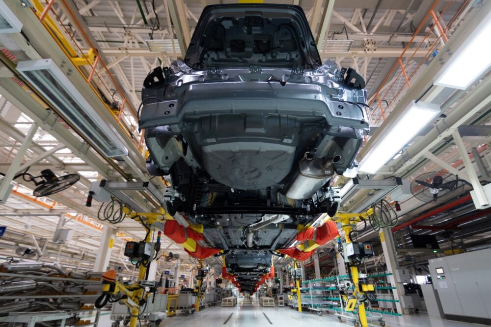 car raised in the air in a shop