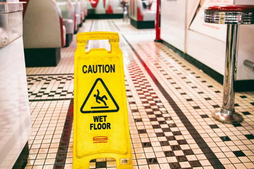 Caution sign sitting on a wet floor.