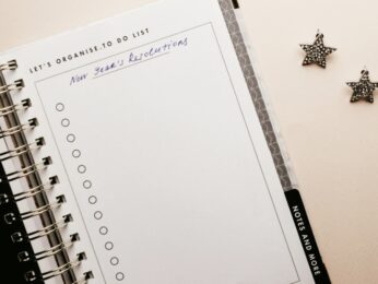 Notebook featuring a blank New Year's resolution list.